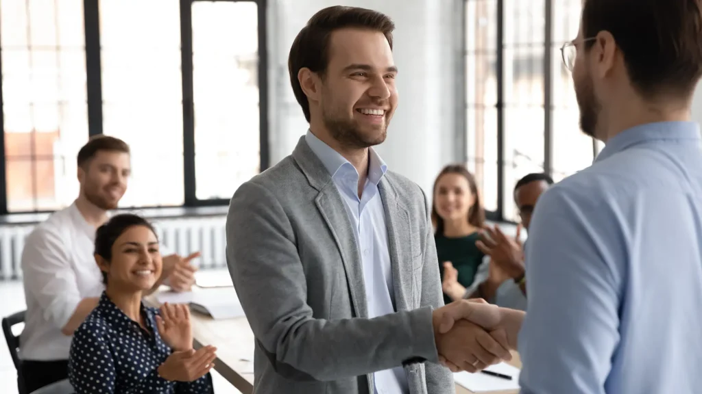 Happy motivated millennial man intern is being hired