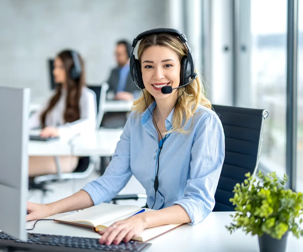 Portrait of female operator ready for online assistance at call center.