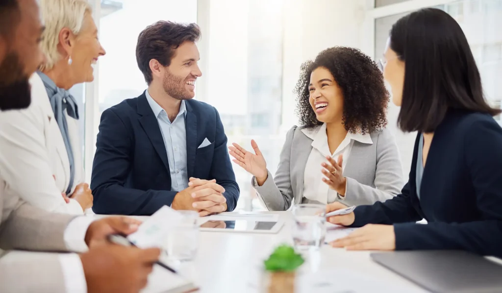 Diversity, conversation and business meeting people laughing